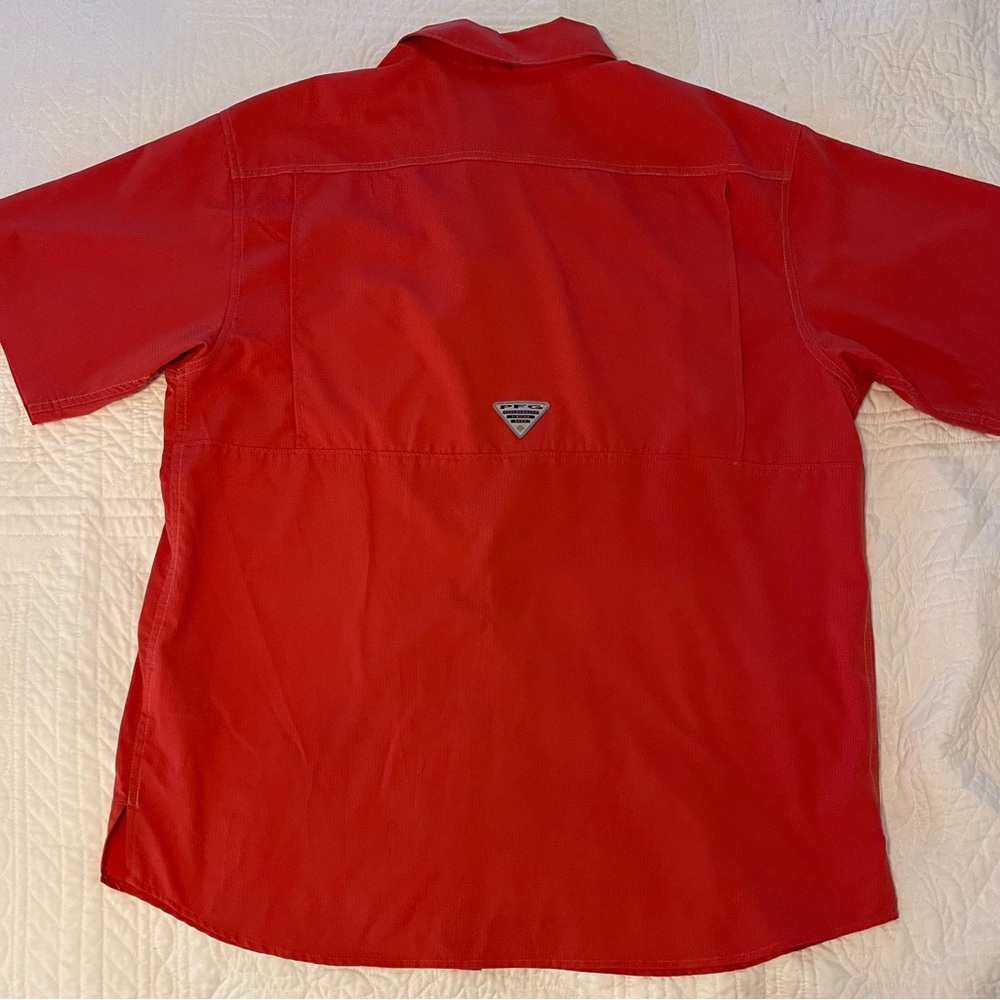 Columbia button down short sleeved shirt with two chest pockets.
